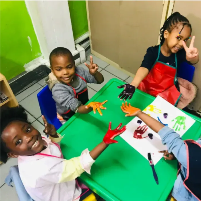 Children enjoying a hand-painting activity